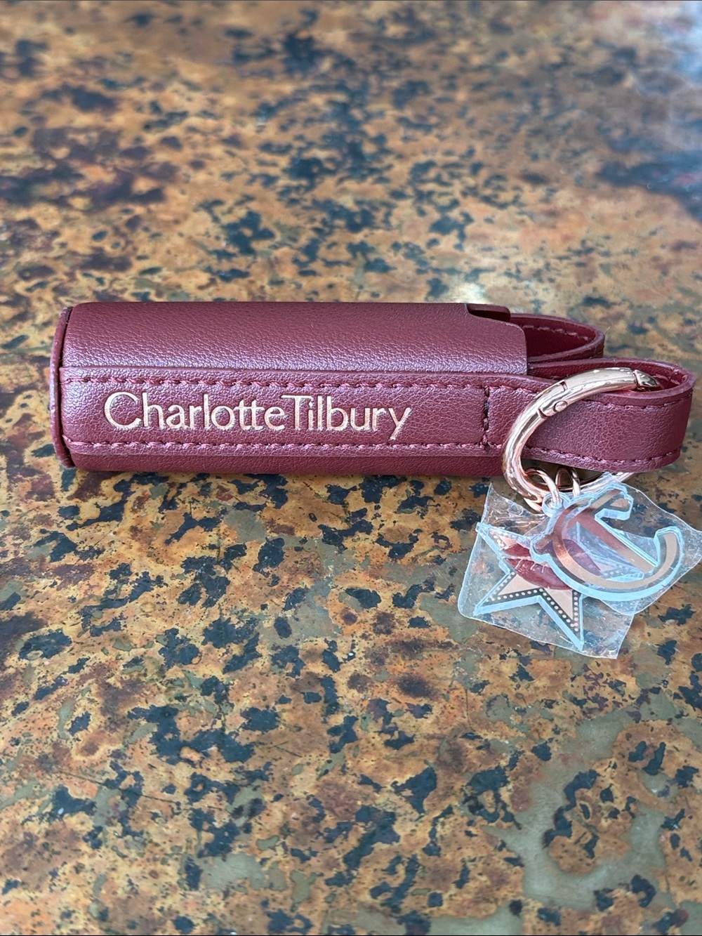 Charlotte Tilbury Burgundy Faux Leather Lipstick & Charm Holder on Gold Keychain